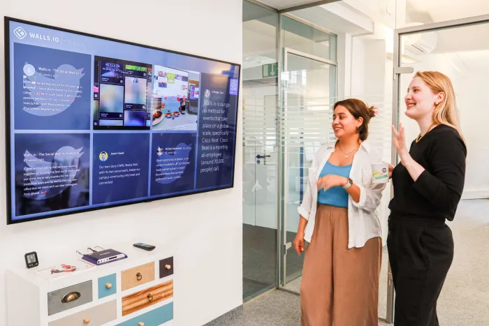 A shared information screen used by people in a collaborative space.